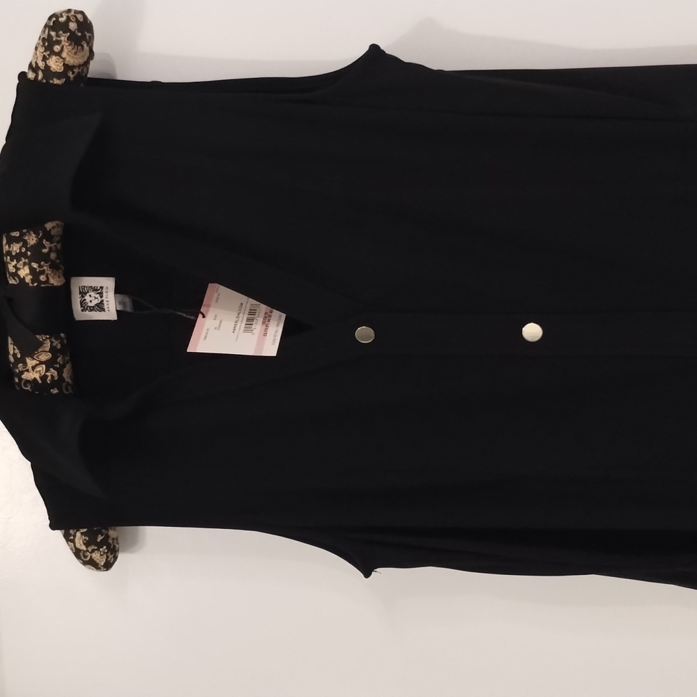 Black midi dress with slits on sides and sash.